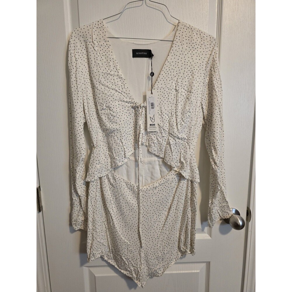 White Minkpink long-sleeve polka dot romper featuring a tie-front V-neck sz L